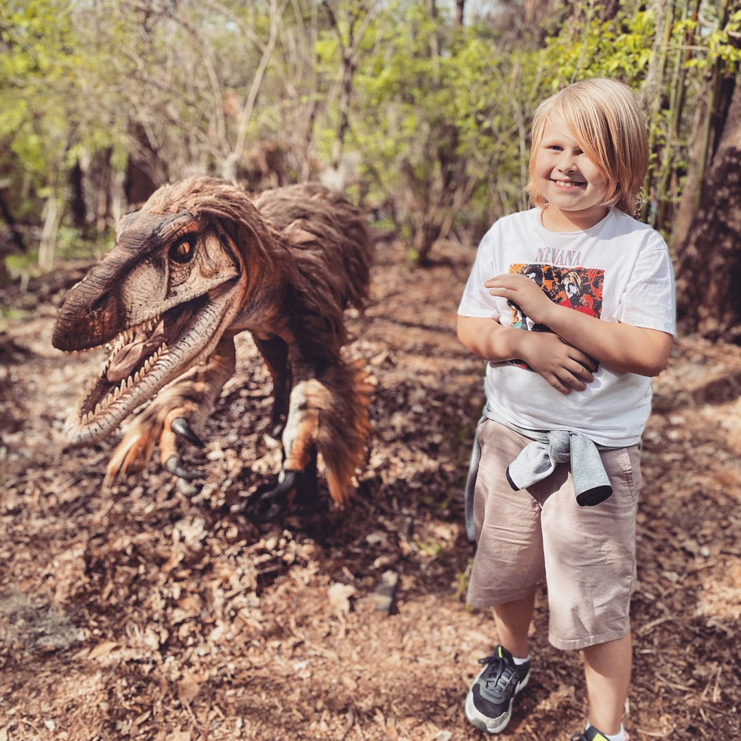 child with dinosaur